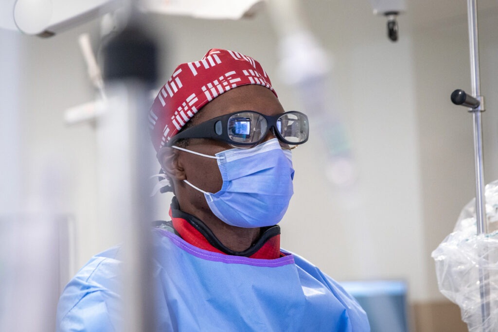 Dr. Andrew Brown looks intently at the screen while performing Dave McManus’ radioembolization treatment.